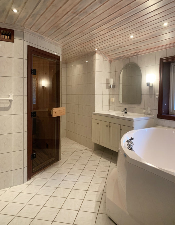  Bathroom with sauna, shower and hot tub. 