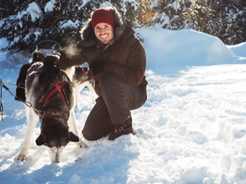  After dog sledding, the dogs need to have some cuddles. 